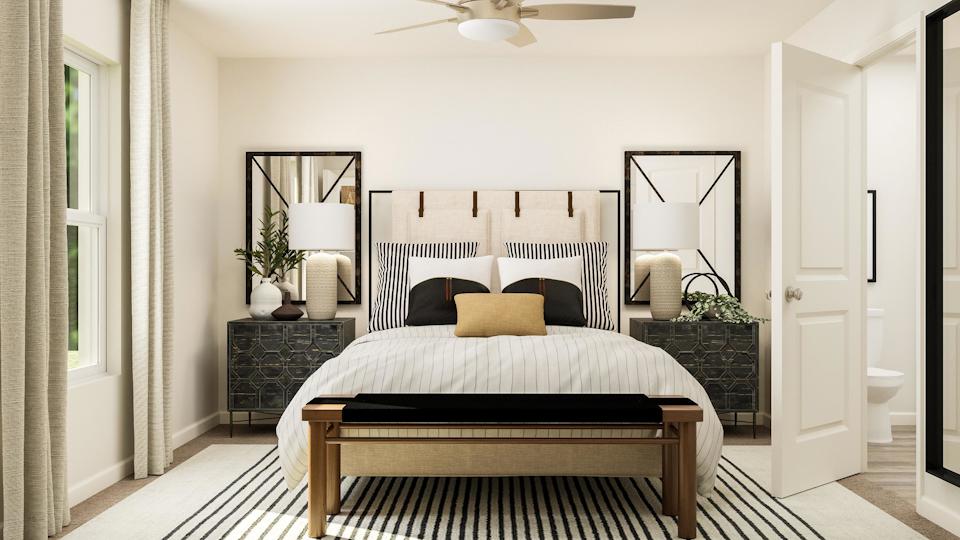 A bedroom with a large bed.