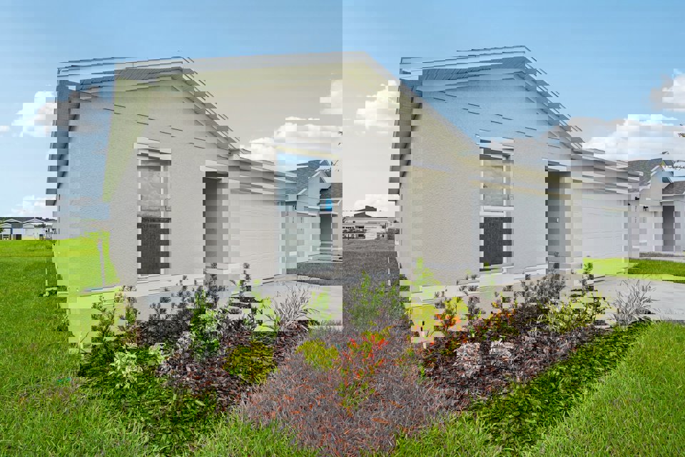 A white house with a driveway.