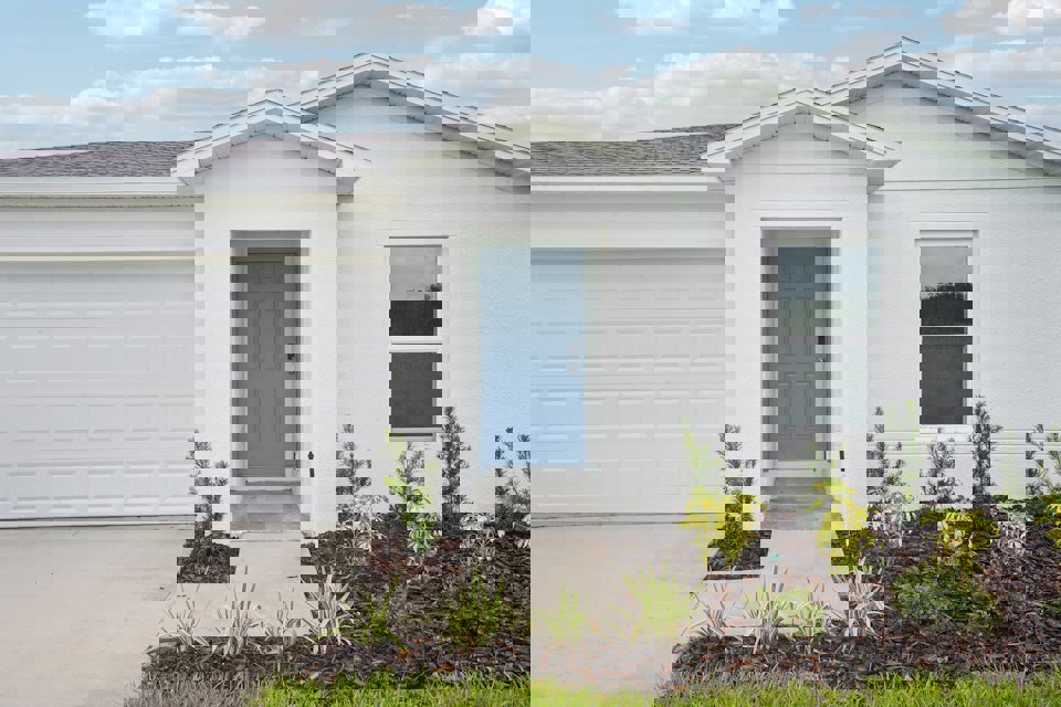 A white house with a blue door.