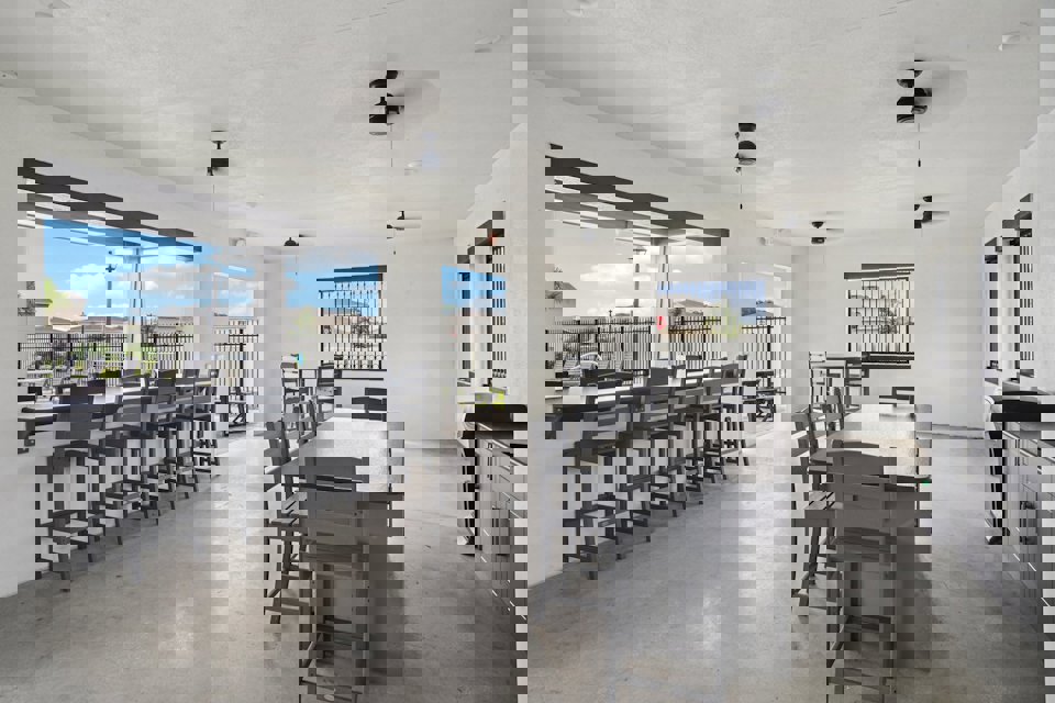 A room with tables and chairs.