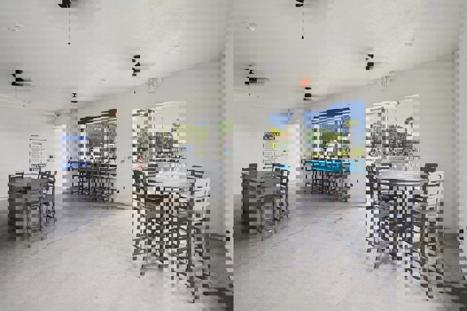 A room with tables and chairs.