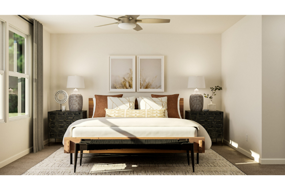 A bedroom with a bed and a fireplace.