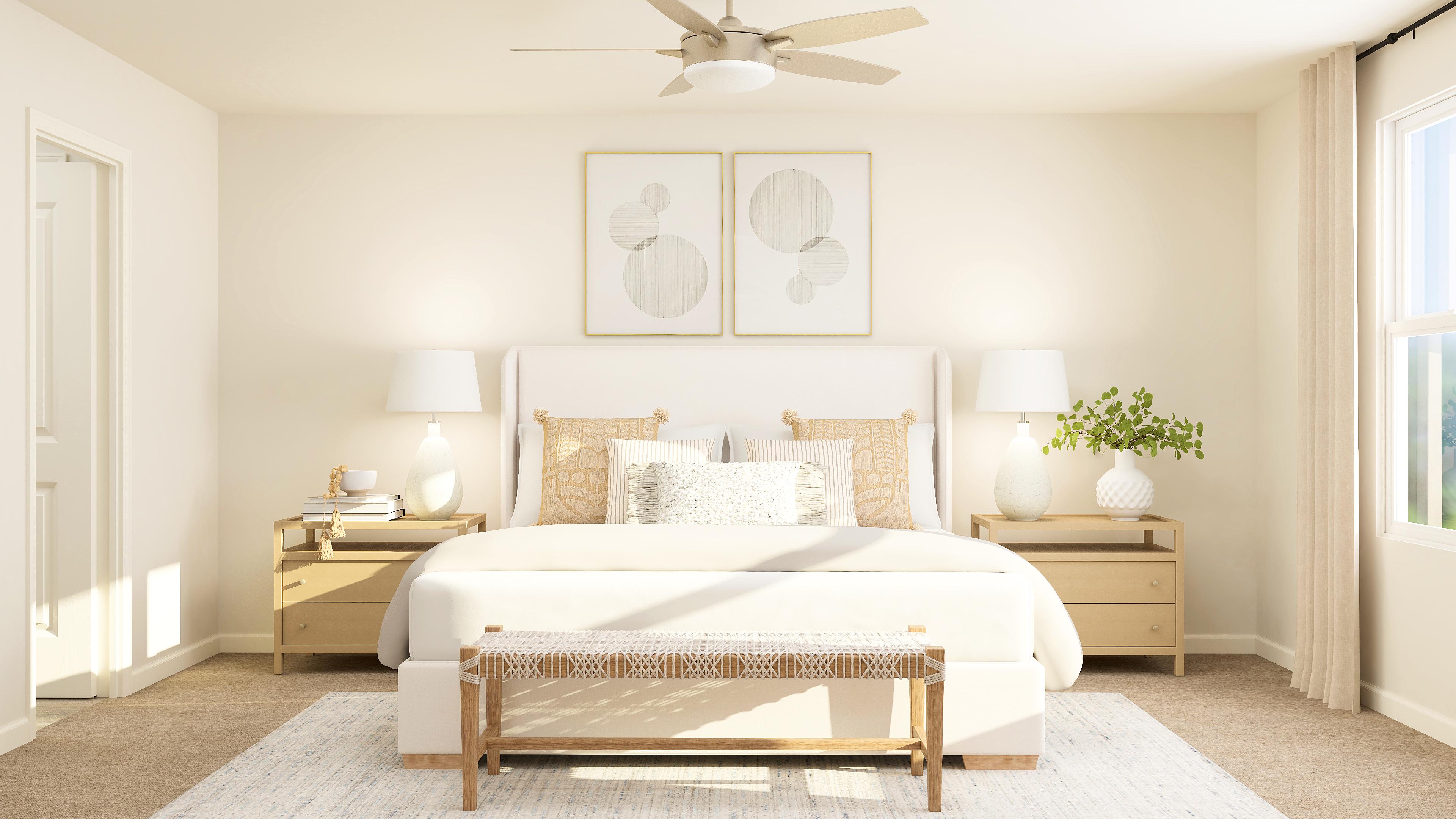 A bedroom with a bed and lamps.