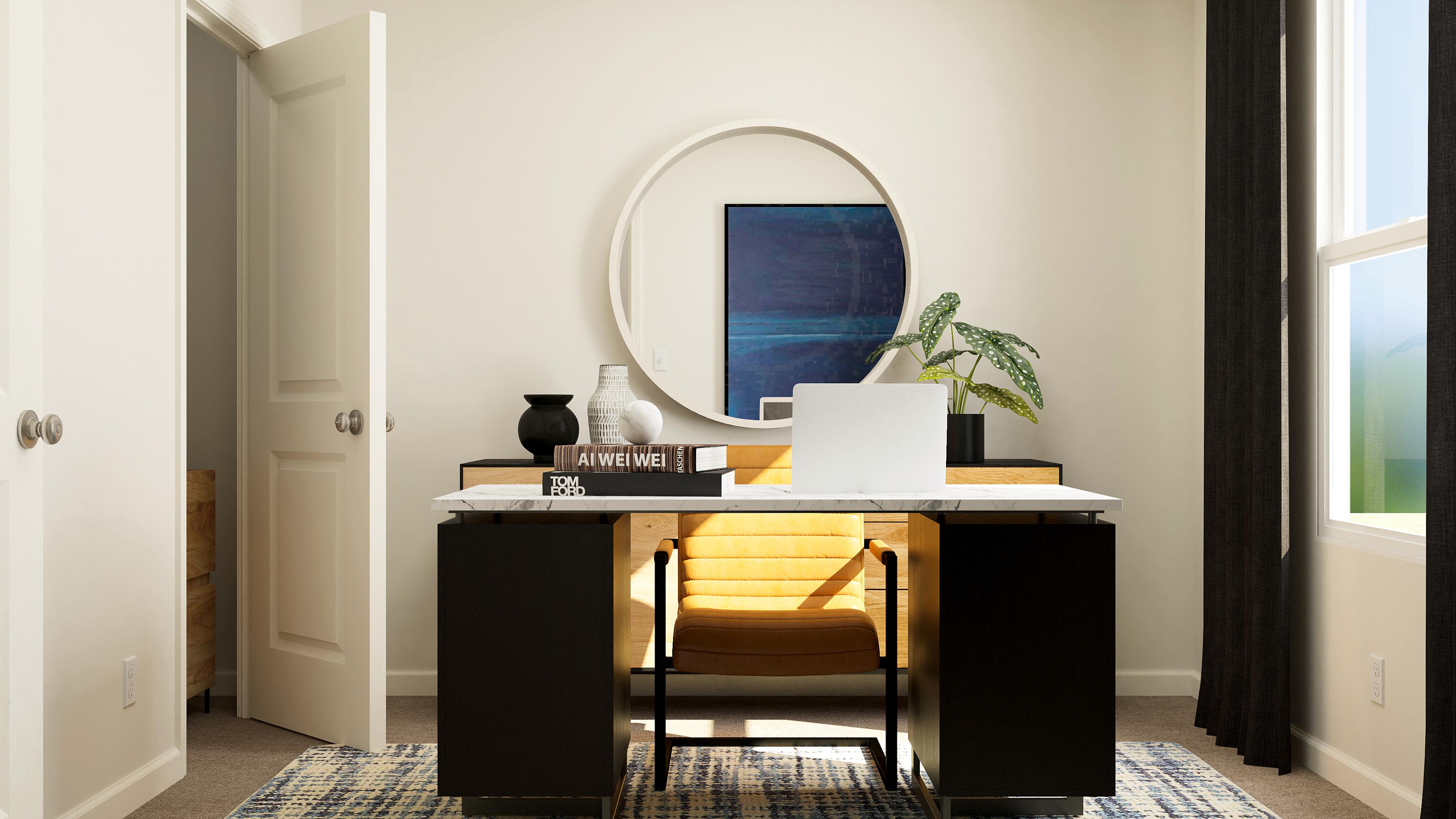 A desk with a laptop on it.