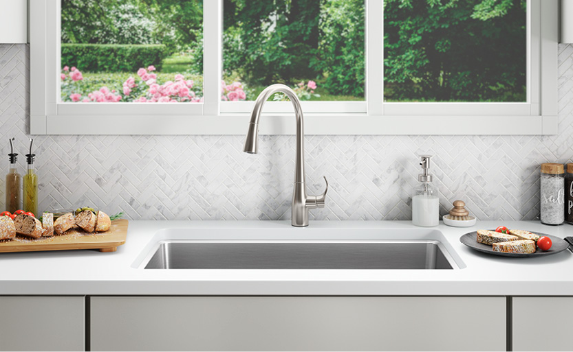 A kitchen sink with a window.